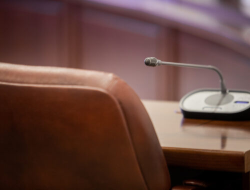 Empty chair at a conference table
